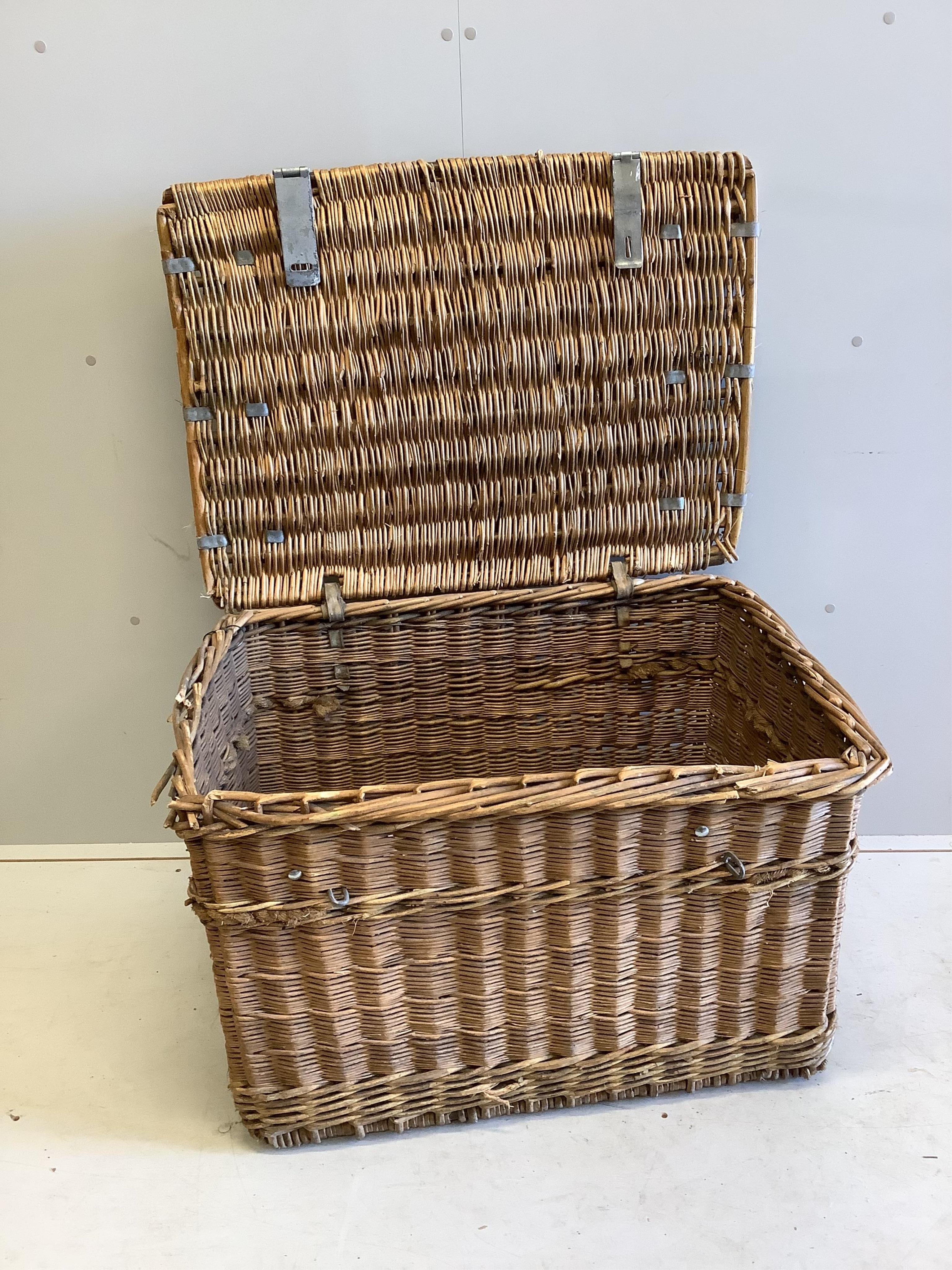 A vintage wicker laundry basket, width 86cm, depth 61cm, height 53cm